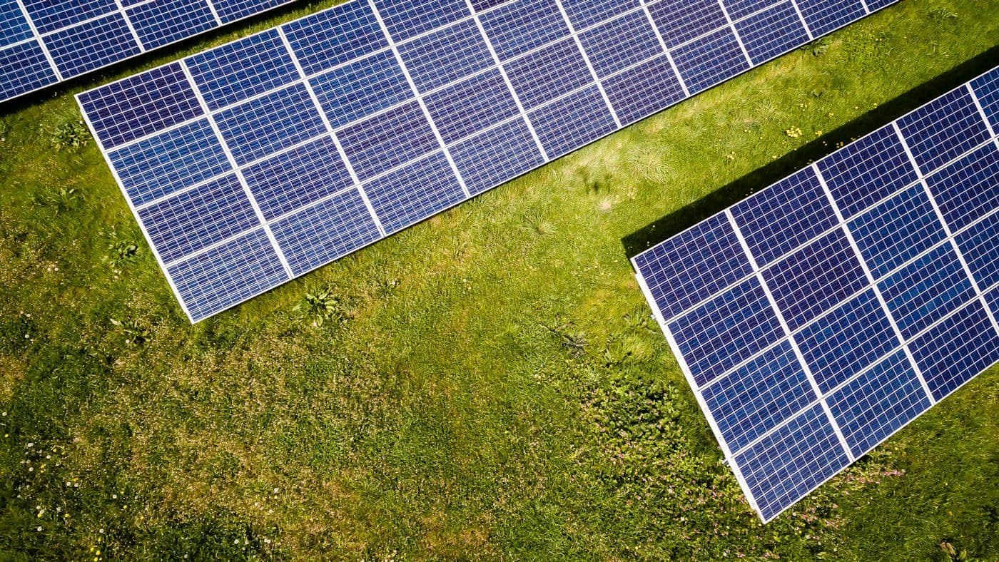 Rows of blue photovoltaic panels in daylight