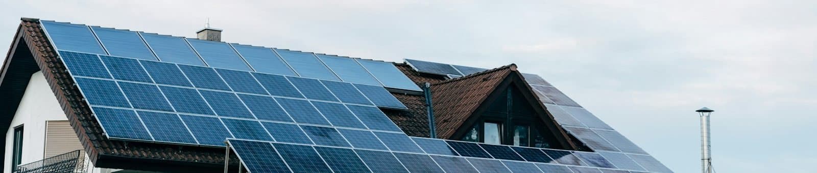 Photovoltaic panels covering the roof of a house